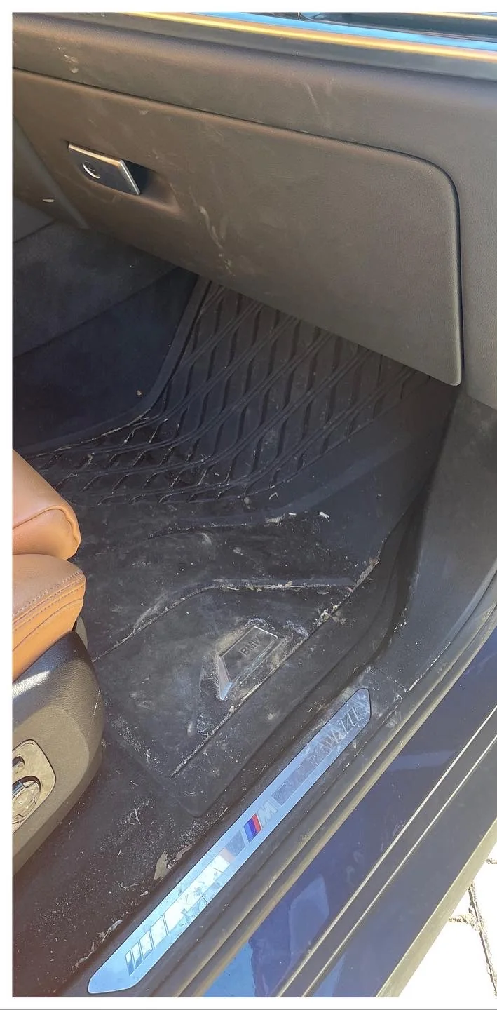 BMW passenger footwell before JKA interior detailing
