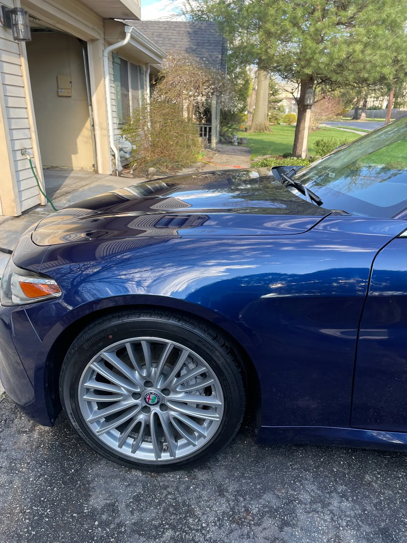 JKA detailer wiping an interior surface with microfiber cloth